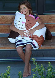 Cat Girl Holding Pillowcase On Bench